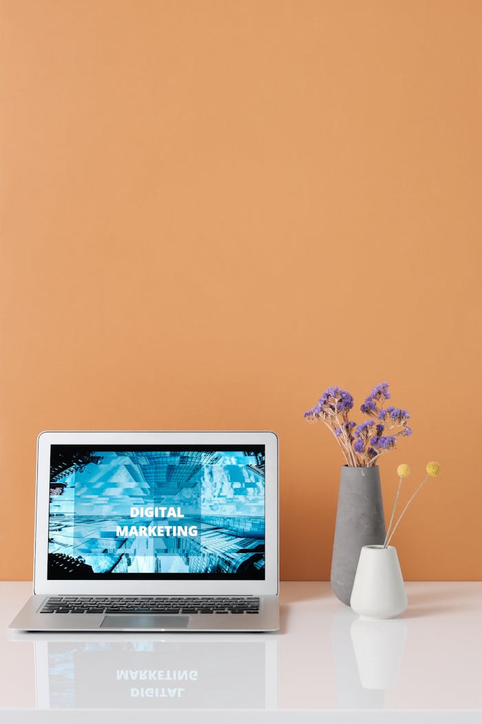 Services Modern workspace with laptop and decorative flowers showcasing digital marketing.
